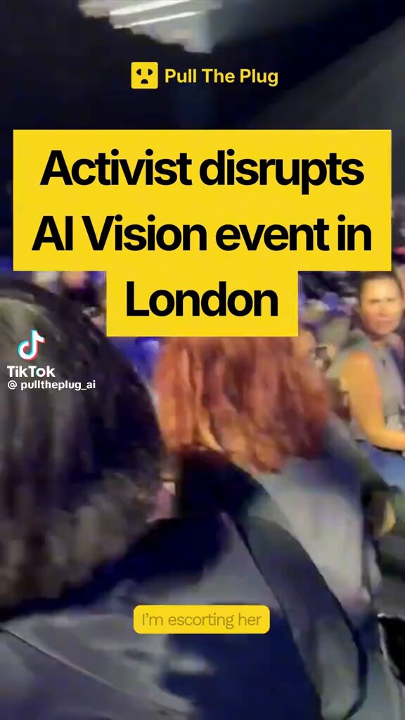 Canva's AI event in London interrupted by The Pull The Plug group activist calling for a data center moratorium and more public input on AI.